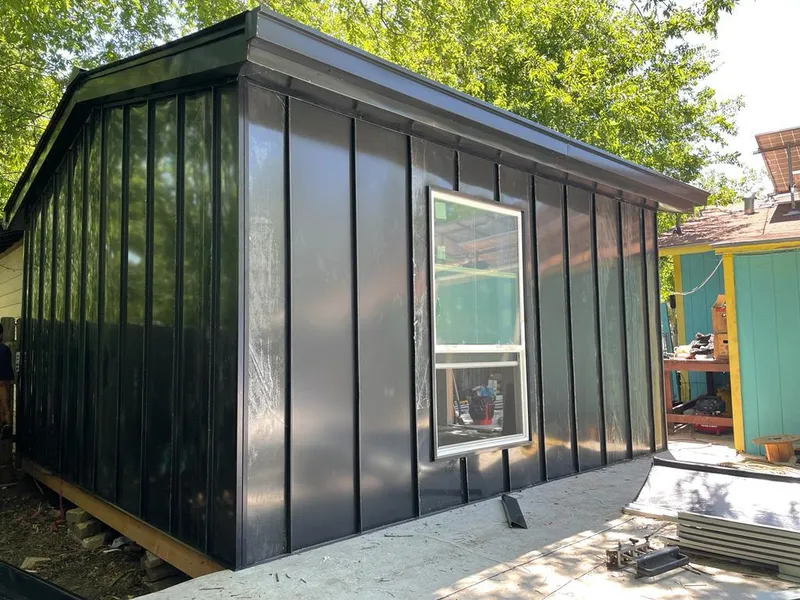 Black standing seam metal wall panels for Metal Roof Installation in Almont