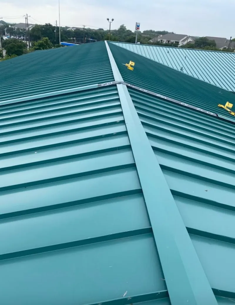 Green commercial metal roof ridge and valley for Metal Roof Repair in Almont