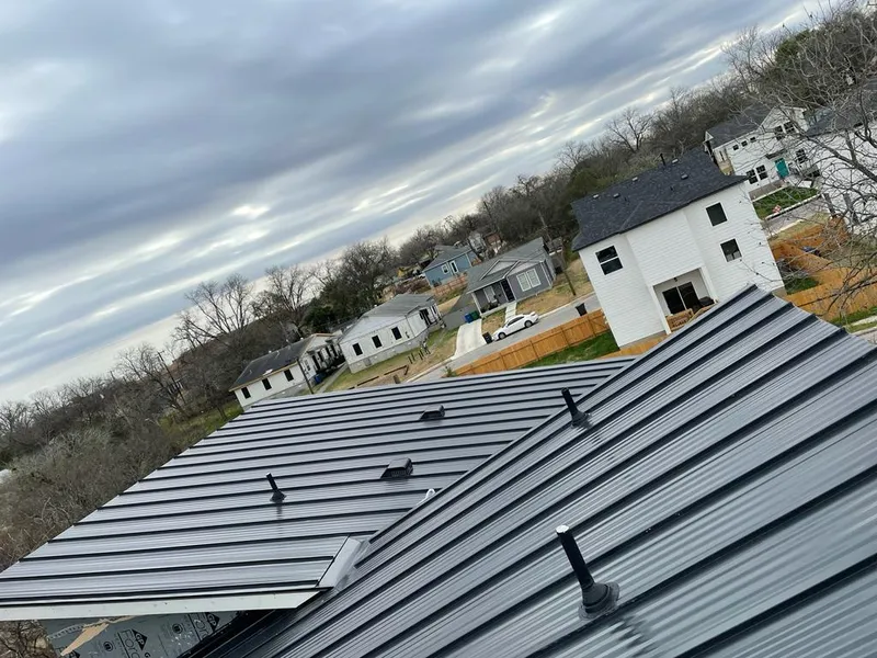 Standing seam metal roof panels with vents for Skylight Repair in Almont